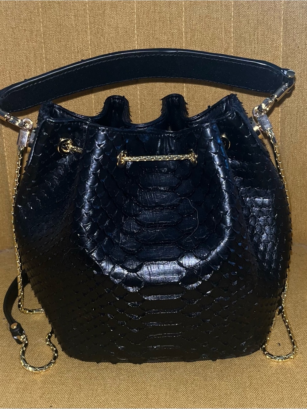 Black Embossed Snakeskin Textured Drawstring Bucket Bag with Gold Chain